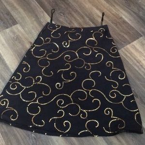- Carole’s little stunning black skirt